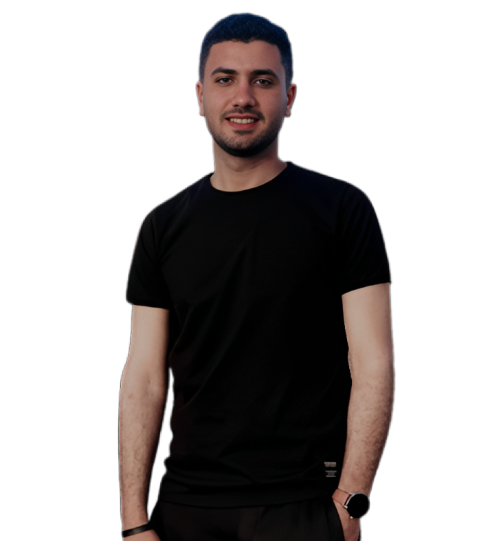 A man in a blue shirt with a happy expression